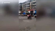 Miniature motorist? Chinese man drives go-kart along busy road