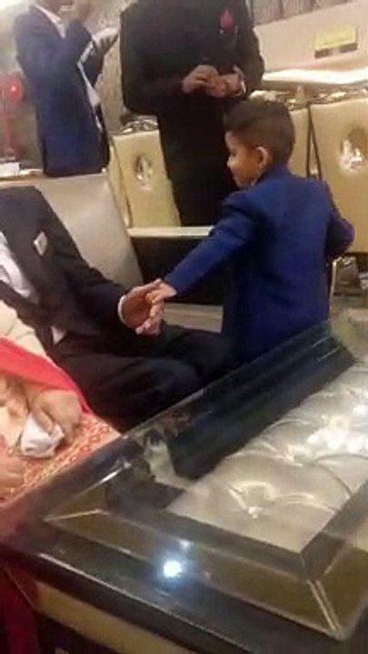 Cute boy asking his grandfather to play