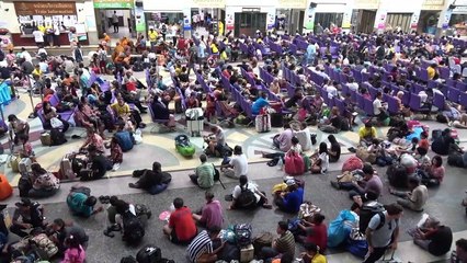 Thais cram onto buses and trains as they begin annual Songkran new year getaway