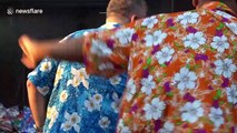 Tourists buy water guns and floral shirts for Thailand's Songkran new year festival