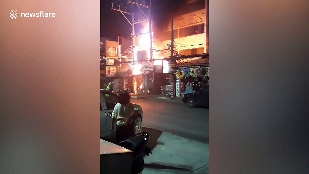 Fire rips through buildings as thousands of tourists splash water in Thai new year celebrations