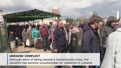 Thousands of Ukrainians use humanitarian corridor to cross Donbass frontline