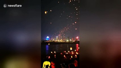 Thousands of lanterns fly into sky to celebrate New Year of China's Dai ethnic group