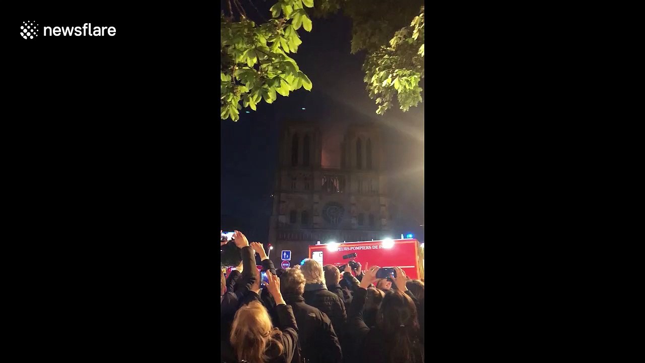 Hymns, prayers as Paris' Notre Dame cathedral burns