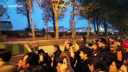 Parisians watch in stunned silence as Notre Dame goes up in flames