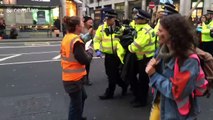 Extinction Rebellion activists carried away by police on second day of protests in London