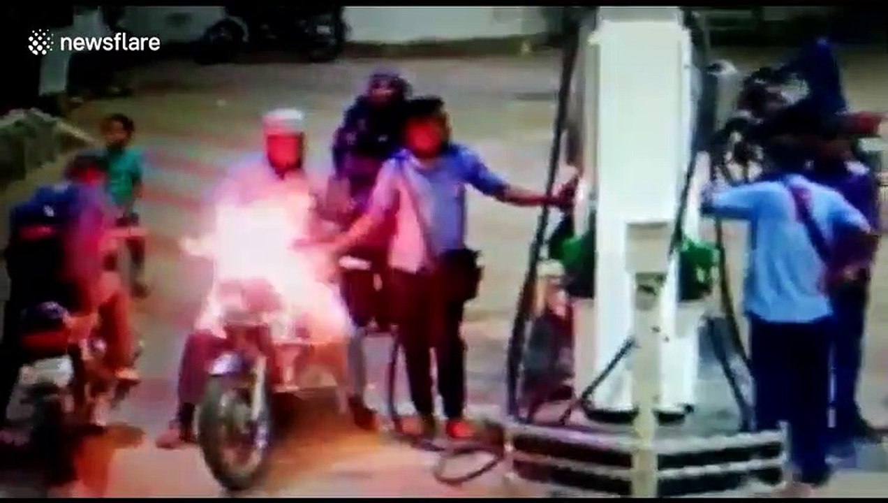 Horrifying moment motorbike catches fire at petrol pump in west India