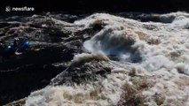 White water raft carrying 5 people is flipped over by huge wave on Gatineau River, Canada