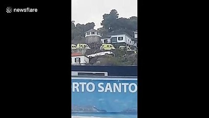 Crashed Madeira tourist bus seen on its side