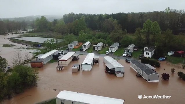 Homes overwhelmed by flash flooding in this drone video