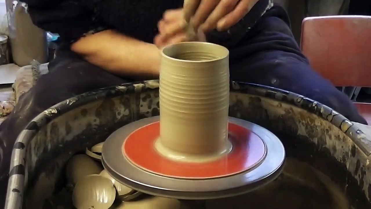 Making _⁄ Throwing a ceramic clay pottery Apple on the wheel
