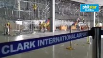 Workers repair Clark International Airport damage caused by strong quake