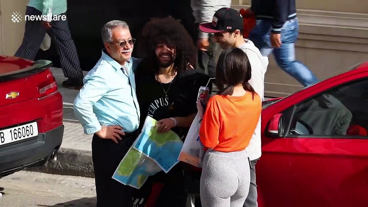 Hilarious falling paper-ball prank on hapless strangers in the street