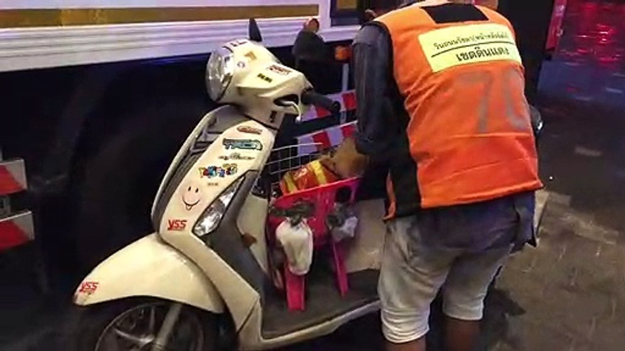 Moped taxi driver in Thailand brings his puppies to ride along with him while he works
