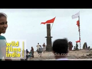 Historic Shiva temple IN the sea with devotees, near Bhavnagar
