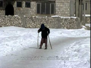 Kashmiri kid skiing on plastic water pipes!