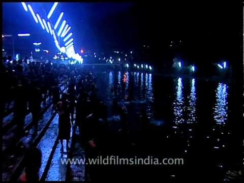 Devotees offering big lighting candles to pampa river