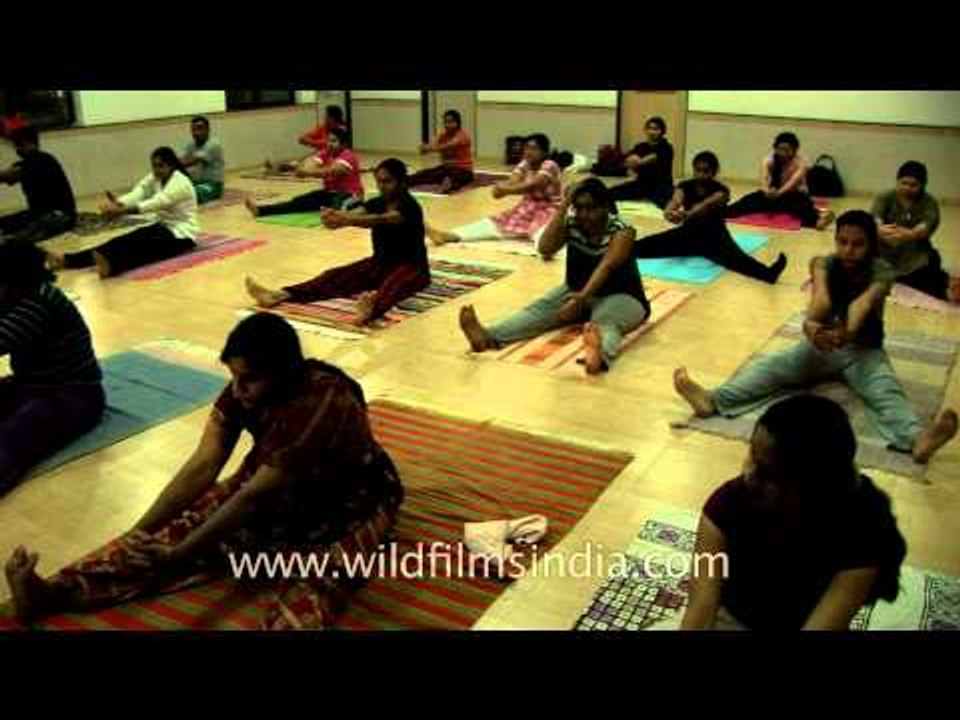 Yoga in dead corpse position - Shavasana at Yoga University, Nasik