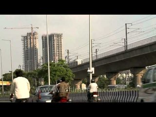 High rise building as backdrop of metro track at Noida Sector 18