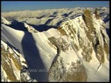 Close-up of a helicopter hovering over a Himalayan peak