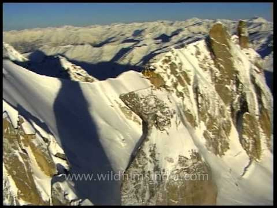 Close-up of a helicopter hovering over a Himalayan peak