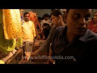 Hundereds offer their devotion to the prankster Lord Krishna