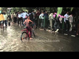 Hang on to the fence to escape the puddle in rain!