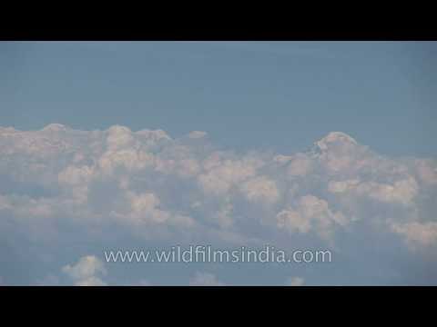 Sikkim's high peaks revealed through the clouds