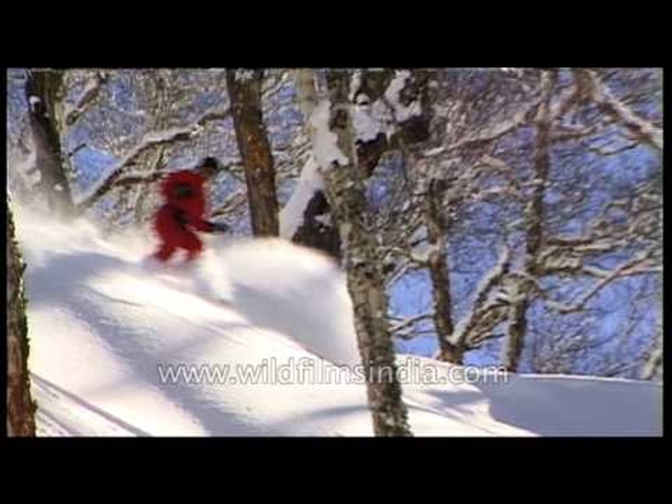 Skiing down snow covered Himalayan slopes