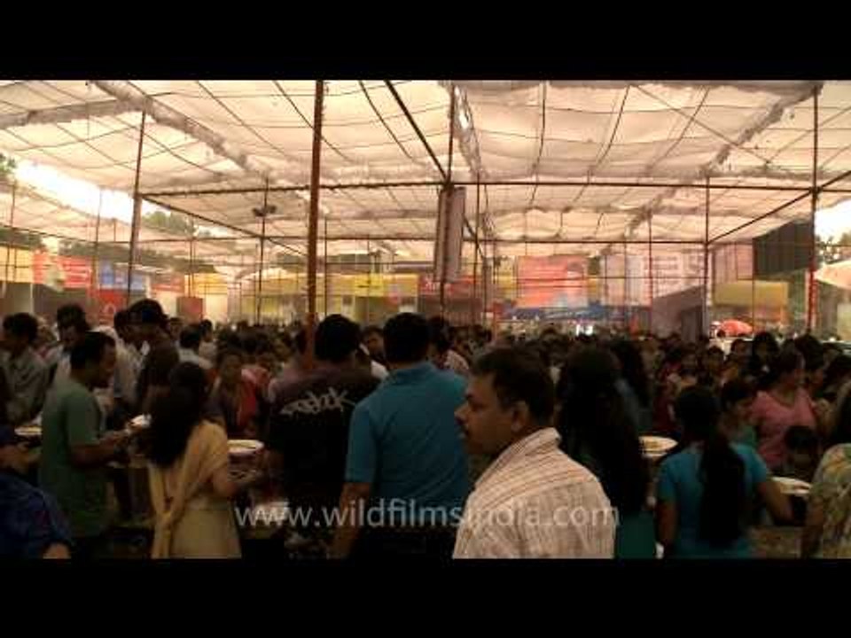 Devotees having bhog prasad on Maha Navmi at CR park