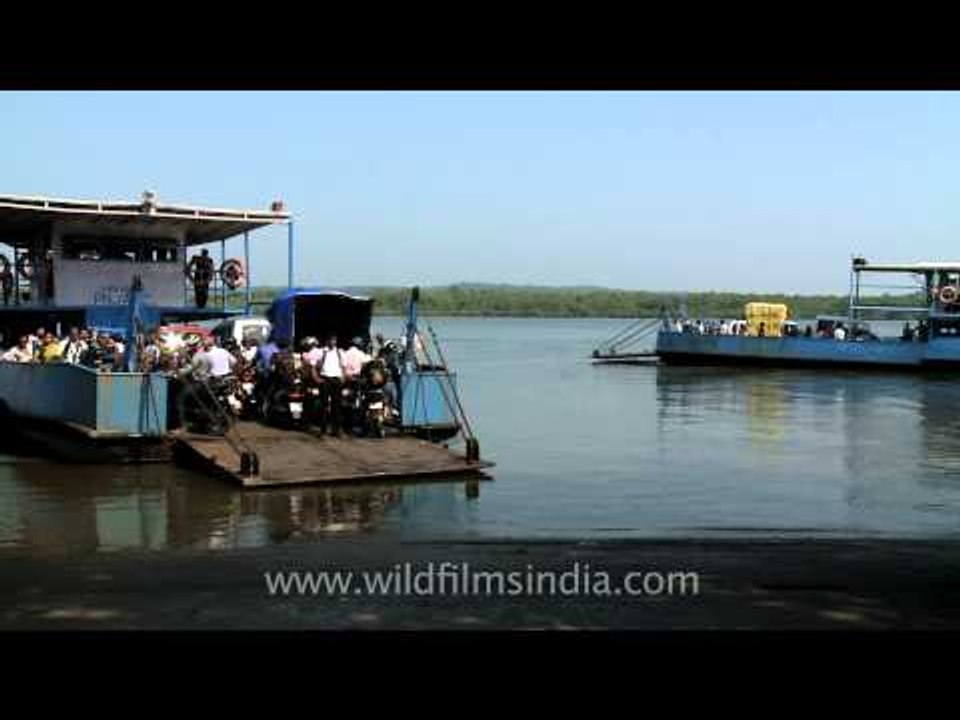 Taking Bikes and cars on Ferries across Mapusa River at Penha de France, Goa