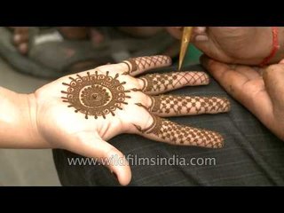Mehendi being applied in Green Park, New Delhi