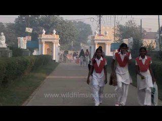 School students walk past Basilica of Our Lady Of Graces