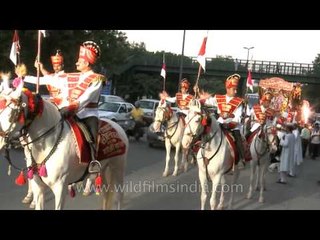 Om Band and horse riders play during Ganesh Chaturthi