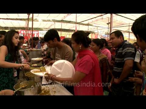 Volunteers serving bhog on the occasion of Durga puja