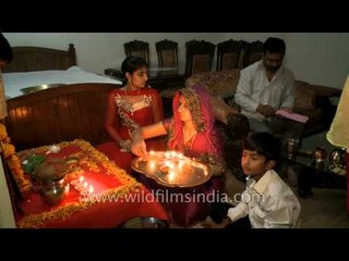 Family gets together for Diwali puja with diyas
