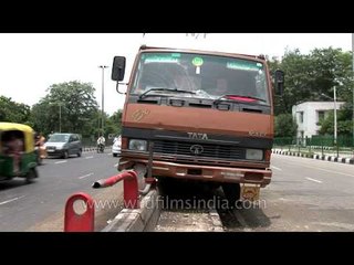Partially damaged truck stuck in the middle of the road, Delhi
