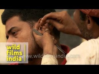 Cleaning dirty ears for a living - a job in India?