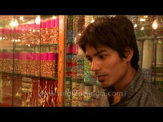 Glistening bangles tease the feminine.