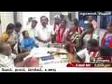 DMK distributes money, food packets to people while filing nominations in Rajapalayam