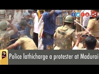 Police lathicharge a protester at Madurai