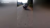 Little overloaded? Man carries motorcycle on top of his motorcycle