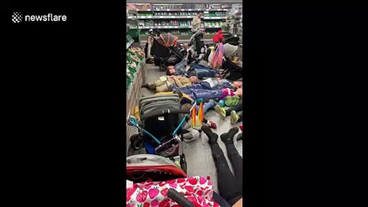 Extinction Rebellion demonstrators stage mass 'die-in' at London supermarket