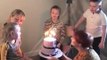 Guy Reacts Excitedly at Football Team Winning Goal During Birthday Cake Cutting