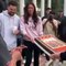 Travis Scott is presented with his birthday cake, as everyone sings "Happy Birthday"
