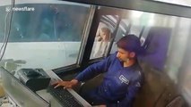 Cheeky monkey caught on camera stealing money from toll booth worker in northern India