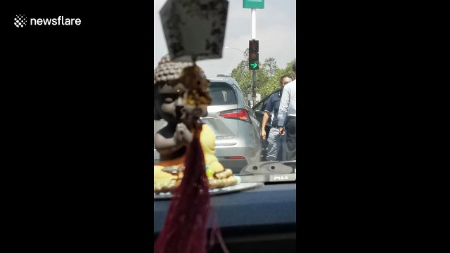 Malaysian drivers stop traffic to have road rage brawl at traffic lights