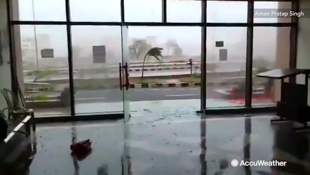 Glass doors and windows shatter under force of...