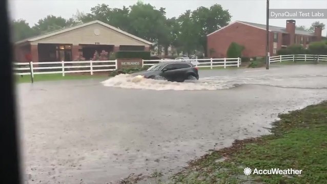 Vehicles dangerously drive through flooded roads