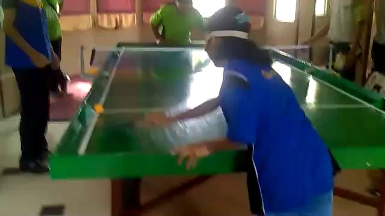 Table tennis match groups of blind people.